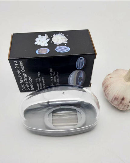 Kitchen Gadgets Plastic Small Garlic CutterProduct material: ABS+PS+304    Product size: 11*4.5*6.5cm