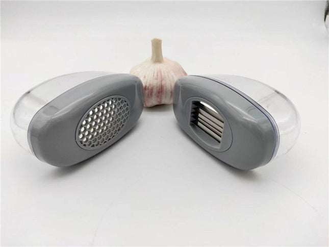 Kitchen Gadgets Plastic Small Garlic CutterProduct material: ABS+PS+304    Product size: 11*4.5*6.5cm