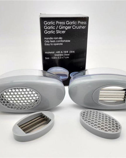 Kitchen Gadgets Plastic Small Garlic CutterProduct material: ABS+PS+304    Product size: 11*4.5*6.5cm