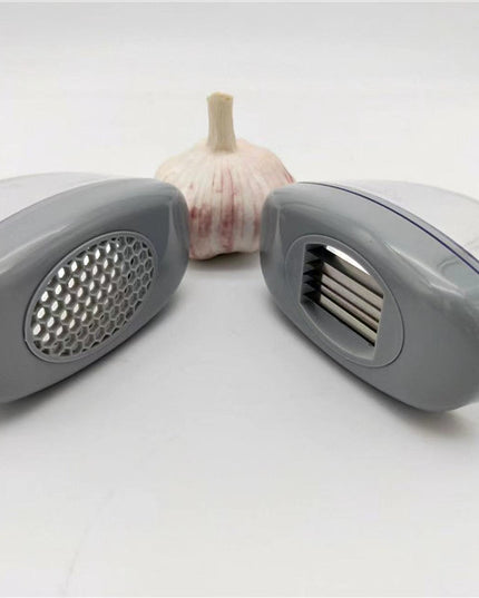 Kitchen Gadgets Plastic Small Garlic CutterProduct material: ABS+PS+304    Product size: 11*4.5*6.5cm 